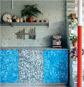  ??  ?? Calming: The eye-catching kitchen has a unique collection of hues and textures