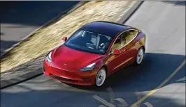  ?? MEL MELCON / LOS ANGELES TIMES ?? The Model 3 is Tesla’s first attempt to appeal to mass-market buyers. The car starts at $35,000 but can run as high as $78,000 and has been plagued by production delays.