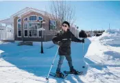  ??  ?? Gérard Ste-Croix snowshoes along Domaine de la Florida’s Cocoa Avenue in March in Quebec’s Saint-Ambroise, Canada.