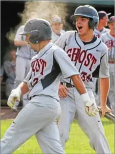  ?? Photo by Steve Sherman ?? Cass DiYeso and Jon Naylor are all pumped up after starter Tim Brennan put Holy Ghost up 6-0 with a bases-loaded triple. The Firebirds went on to win their first district title since 2003.