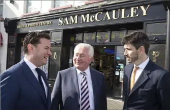  ??  ?? Ian Daly from Cardinal Capital Group, Sam McCauley and Jonathan Cosgrave, from the Carlyle Group at last week’s investment announceme­nt outside Sam McCauley’s Greystones, Co Wicklow outlet.