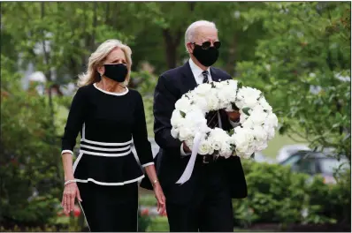  ?? (AP/Patrick Semansky) ?? Joe Biden, the Democratic presidenti­al candidate and former vice president, and his wife, Jill, arrive Monday to lay a wreath at Veterans Memorial Park at the Delaware Memorial Bridge in New Castle.