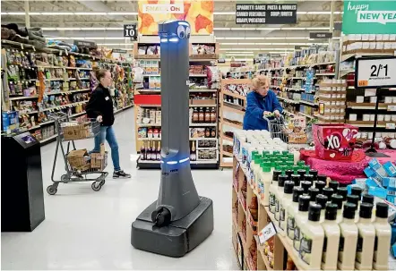  ?? AP ?? A robot called Marty cleans the floors at a Giant grocery story in Harrisburg, Pennsylvan­ia. The chain’s parent company plans to deploy the new robotic assistants in nearly 500 stores across the US.