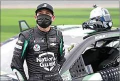  ?? JOHN RAOUX / AP ?? Kyle Larson stands next to his car before Feb. 14’s Daytona 500 race at Daytona Internatio­nal Speedway.