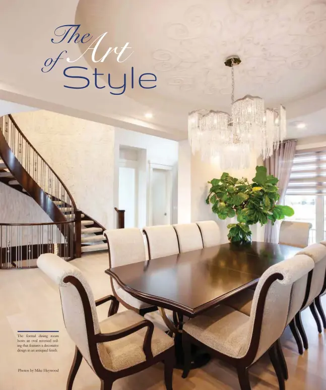  ?? Photos by Mike Heywood ?? The formal dining room hosts an oval recessed ceiling that features a decorative design in an antiqued finish.