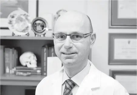  ??  ?? Dr. Michael Cusimano is a neurosurge­on and researcher at St. Michael’s Hospital in Toronto, as well as an avid soccer fan. He led a research team that examined the 2014 FIFA World Cup.