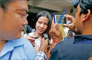  ?? PHA LINA ?? Kem Sokha’s alleged mistress, Khom Chandaraty (centre), also known as Srey Mom, leaves Phnom Penh Municipal Court in June after facing questionin­g.