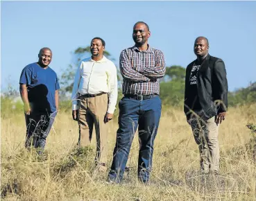  ?? Pictures: Alaister Russell ?? From left, Philasande Dotyeni, Themba Boqwana, Thando Wontoti and Buntu Nonkalela on the plot of land they secured an agreement to buy — a purchase funded by 200 buyers who put in R40 000 each — in East London in the Eastern Cape.