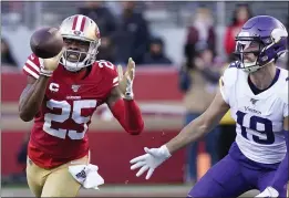  ?? TONY AVELAR — THE ASSOCIATED PRESS ?? 49ers cornerback Richard Sherman intercepts a pass in front of Minnesota Vikings wide receiver Adam Thielen during the second half of an NFL divisional playoff game in Santa Clara.