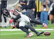  ?? AP-Butch Dill, Bill Feig / ?? Top: New Orleans Saints scramble on the turf to pick up a fumble by the Atlanta Falcons in the first half of an NFL football game in New Orleans. Above: Falcons wide receiver Julio Jones fumbles as he is hit by New Orleans Saints middle linebacker Alex Anzalone in last Thursday’s game.