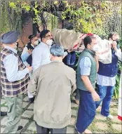  ?? —ANI ?? Congress leader Rahul Gandhi gives a shoulder to the mortal remains of party leader Captain Satish Sharma who passed away on February 17, in New Delhi on Friday.