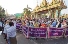  ?? THEIN ZAW/ASSOCIATED PRESS ?? Supporters of the Myanmar military protest election results in Yangon, Myanmar, on Saturday. The signs say, “Do not accept interferen­ce by foreign countries.”