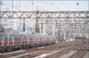  ?? Tyler Sizemore / Hearst Connecticu­t Media ?? A train departs the Stamford Transporta­tion Center as another approaches the station.