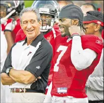  ?? CURTIS COMPTON / CCOMPTON@AJC.COM ?? Falcons owner Arthur Blank is likely to grant Michael Vick’s wish to retire as a Falcon, even though Vick lied to Blank about running a dogfightin­g ring.