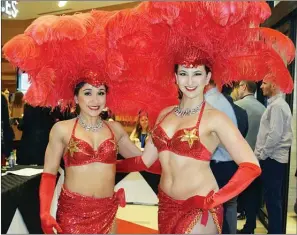  ?? DAVID CROMPTON/Penticton Herald ?? A pair of showgirls added plenty of colour and panache at the official opening of Cascades Casino Penticton on Wednesday.