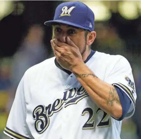  ?? ASSOCIATED PRESS ?? Brewers starting pitcher Matt Garza reacts after being taken out of the game against the Pirates on Monday. Garza allowed four runs in 5 1⁄3 innings.