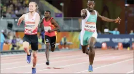  ?? Picture: REUTERS ?? IN THEIR STRIDE: James Arnott of England in action with Suwaibidu Galadima of Nigeria in the men’s T47 100m final.