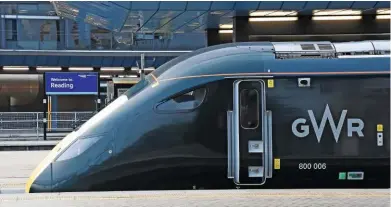  ?? MARK PIKE. ?? Great Western Railway 800006 stands at Reading on November 14, with the 0815 London Paddington-Cardiff Central. The train was ordered by Department for Transport as part of the £5.7 billion IEP contract, while Reading station remodellin­g cost £895...