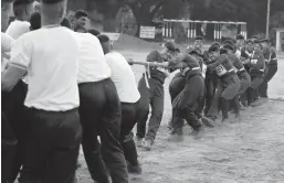  ?? AIJAZ RAHI/AP ?? Female Indian army recruits compete in a tug-of-war with male recruits. A court ruling now lets women apply for top careers in the South Asian country’s military.