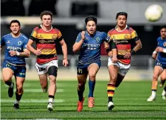  ?? GETTY IMAGES ?? Josh Timu chases the ball ahead of Daniel Sinkinson and Bailyn Sullivan of Waikato at Forsyth Barr Stadium in Dunedin yesterday.