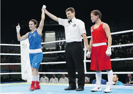  ?? FRANK FRANKLIN II/THE ASSOCIATED PRESS ?? Canada’s Mandy Bujold, left, celebrates after winning her women’s flyweight 51-kilogram preliminar­y boxing match Friday against Yodgoroy Mirzaeva of Uzbekistan in Rio de Janeiro. Bujold will face China’s Ren Cancan in the quarter-finals Tuesday.