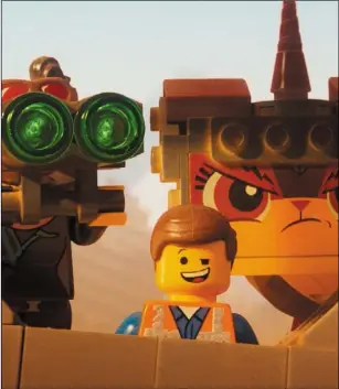  ?? Lego Movie 2. The ?? Lucy (voiced by Elizabeth Banks), Emmet (Chris Pratt) and Unikitty (Alison Brie) in