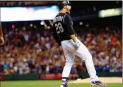  ?? ASSOCIATED PRESS ?? COLORADO ROCKIES’ NOLAN ARENADO YELLS after hitting a two-run triple off Arizona Diamondbac­ks starting pitcher Zack Greinke during the eighth inning Tuesday in Denver. Colorado won 4-3.