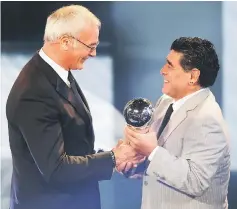  ??  ?? Diego Armando Maradona (right) presents The Best FIFA Men’s Coach of 2016 Award to Claudio Ranieri during The Best FIFA Football Awards ceremony in Zurich. — Reuters photo