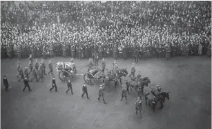  ?? ?? The coffin of the Unknown Warrior in procession through the streets of London, 1920