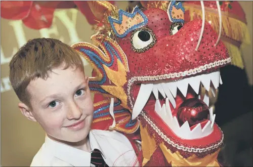  ?? PICTURE: MARIE CALEY. ?? LOOKING EAST: Pupil Preston Kerry, 11, joining in the celebratio­n of Chinese customs, aimed at raising awareness of the language and culture.