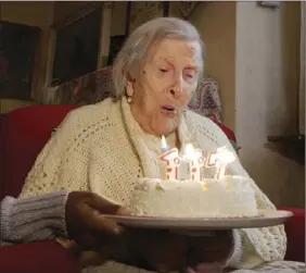  ?? PHOTO/ANTONIO ?? In this Nov. 29, 2016 file photo, Emma Morano, 117, blows candles on the day of her birthday in Verbania, Italy. An Italian doctor says Saturday that Morano, at 117 the world’s oldest person, has died in her home in northern Italy. AP CALANNI