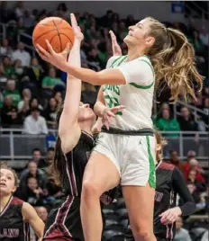  ?? Pittsburgh Post-Gazette ?? South Fayette’s Erica Hall drives to the basket against Oakland Catholic in the Class 5A championsh­ip Saturday at Petersen Events Center.