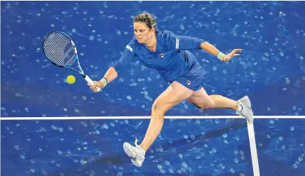  ?? AFP ?? Kim Clijsters of Belgium plays against Garbine Muguruza of Spain in the first round of the WTA event in Dubai.