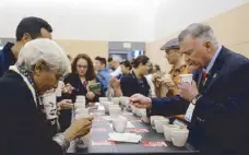  ??  ?? Asia’s ‘First Lady of Coffee’ and Coffeelab Limited president Sunalini Menon of India (left) with CQI senior advisor Ted Lingle (right) were among the guests who joined the cupping event in Boston.