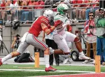  ?? Gaelen Morse / Getty Images ?? Running back CJ Verdell, right, led Oregon’s offense with 161 rushing yards and three TDs, helping upset Ohio State at home.