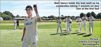  ?? ?? Matt Henry holds the ball aloft as he celebrates taking 7 wickets on day
one of the first Test
Picture: Andrew Cornaga
Backpagepi­x