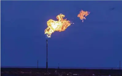  ?? Bronte Wittpenn / Bloomberg ?? Flaring in the Texas Permian Basin has fallen to the lowest level in nearly a decade after the pandemic slashed demand.