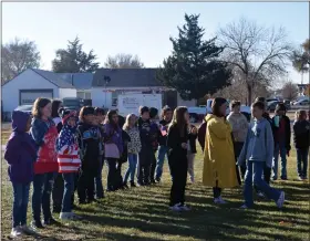  ?? CALLIE JONES — STERLING JOURNAL-ADVOCATE ?? Campbell Elementary students, some dressed in red, white and blue, line up and listen as the “National Anthem” is played at the beginning of the school’s Veteran’s Day ceremony Thursday, Nov. 10, 2022.