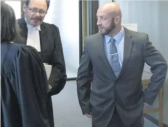  ??  ?? Darren Smalley, right, a British sailor charged with sexual assault causing bodily harm and participat­ing in a sexual assault involving one or more people, outside the courtroom in Halifax this month.