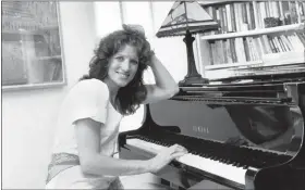  ?? AP PHOTO, FILE ?? Lucy Simon sits at the piano in her New York apartment on May 28, 1982. Simon, the composer who received a Tony nomination in 1991 for her work on the long-running Broadway musical “The Secret Garden,” died Thursday at her home in Piedmont, N.Y., after a long battle with breast cancer. She was 82.