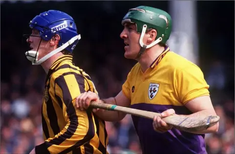  ??  ?? Wexford full-back Eamon Cleary, seen here keeping tabs on Kilkenny’s Christy Heffernan, endured some crushing defeats in Tom’s company.
