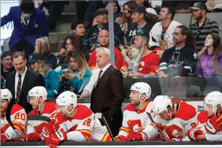  ?? The Associated Press ?? Calgary Flames coach Darryl Sutter watches during the third period of the team’s game against San Jose Sharks in San Jose, Calif., on April 7. Calgary is now preparing for the playoffs.