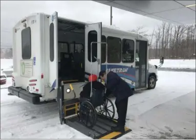  ?? SUBMITTED ?? Laketran driver George Kasunic assists Mentor-on-the-Lake resident Barbara Green on Jan. 9. The transit agency’s Dial-aRide service has significan­tly increased over the last few years.