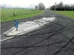  ??  ?? A traffic island installed to deter boy racers from skidding at the Kaimataru and Banks roads intersecti­on in Rongotea has not had the desired effect.