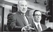  ?? Andrew Harnik Associated Press ?? ECONOMIC ADVISOR Gary Cohn and Treasury Secretary Steve Mnuchin discuss Trump’s tax plan.