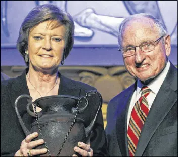  ?? JOHN BAZEMORE / ASSOCIATED PRESS ?? Former Georgia football coach Vince Dooley keeps a busy schedule even though he’s retired. He was at the Fox Theatre in Atlanta on Wednesday to present the Coach Wooden Citizenshi­p Cup to outgoing Tennessee women’s basketball coach Pat Summitt.