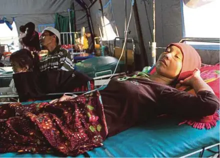  ?? AFP PIC ?? An Indonesian woman infected with malaria recuperati­ng at a clinic in Gunung Sari, West Lombok, recently.