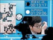  ?? WU HONG/EPA ?? China’s top Go board game player, Ke Jie, is shown on a screen Tuesday after losing a match to Google’s AlphaGo.