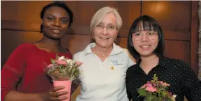  ?? UNBC HANDOUT PHOTO ?? Prince George Philanthro­pic Education Organizati­on president Beth Quesnel, centre, presented a scholarshi­p to UNBC PhD students Christiana Onabola and Hooi Xian Lee on Wednesday.