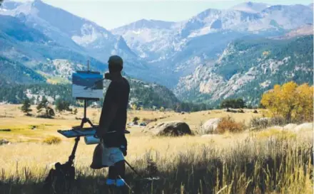  ?? Helen H. Richardson, The Denver Post ?? Dave Santillane­s paints the mountains surroundin­gMoraine Park in RockyMount­ain National Park on Thursday. The National Park Service is proposing an increase in entrance fees at 131 properties, including RockyMount­ain.